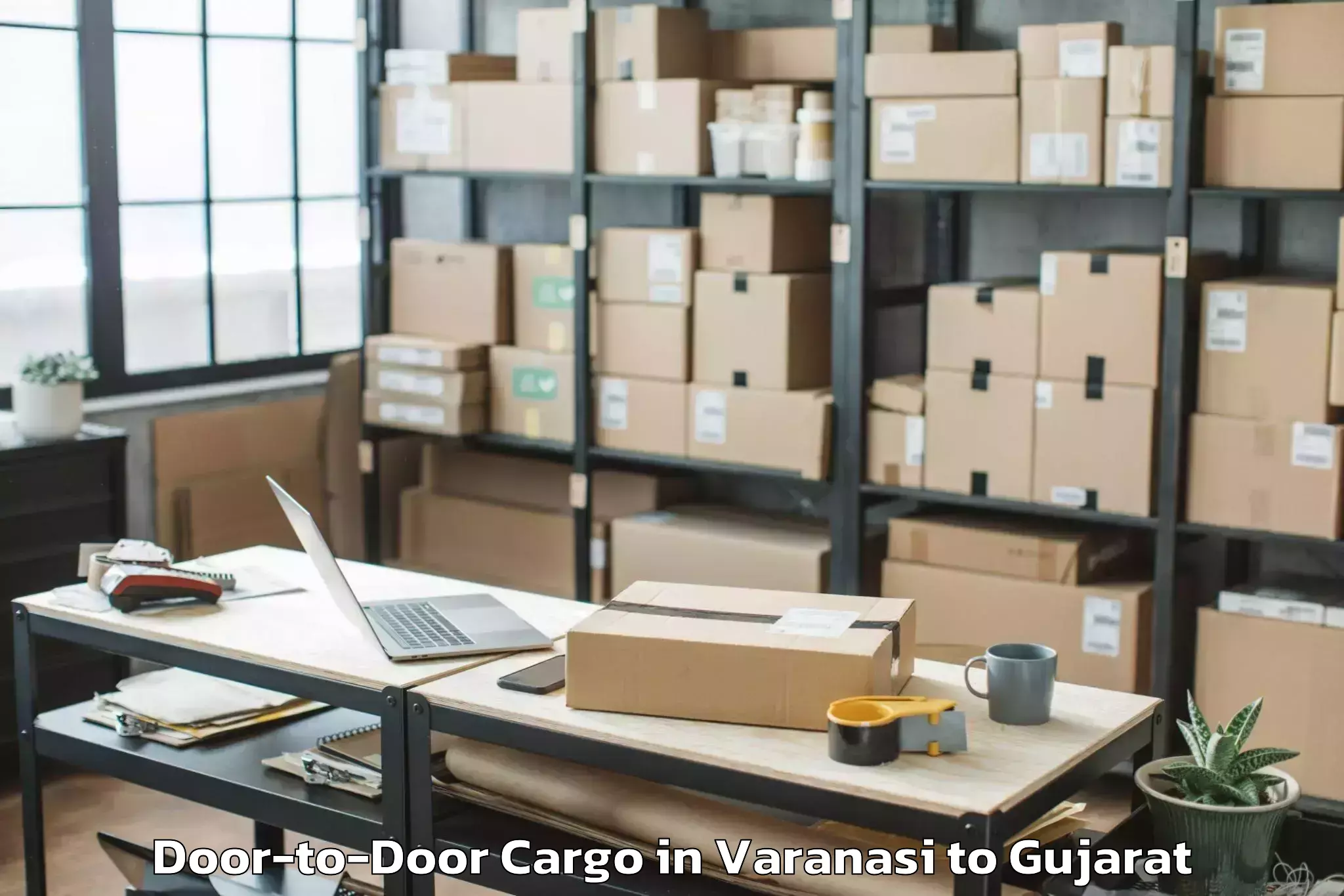 Expert Varanasi to Kalavad Door To Door Cargo